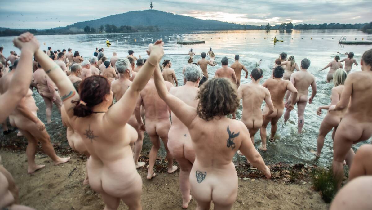 Swimmers take a winter solstice dip off a strip of sand in Canberra. Picture by Karleen Minney.