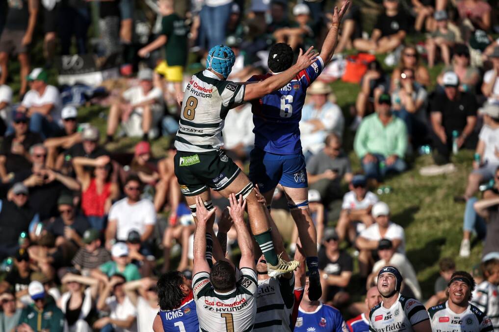LIFTED: Manly's Hunter Ward battles for lineout possession against Warringah's Richard Clift. Picture: David MacLean