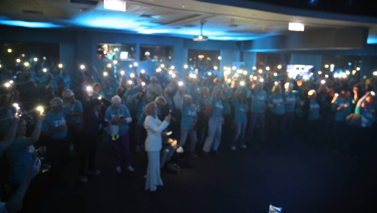 CROWD: Torches in the air at Steggall's election party. Picture: Sarah Waller