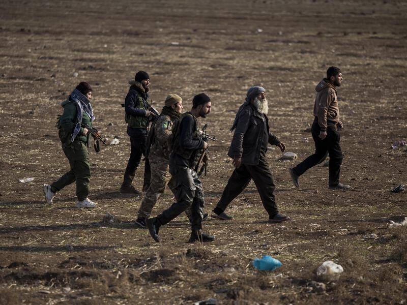 Syrian Democratic Forces fighters escort suspected Islamic State militants in Hassakeh.