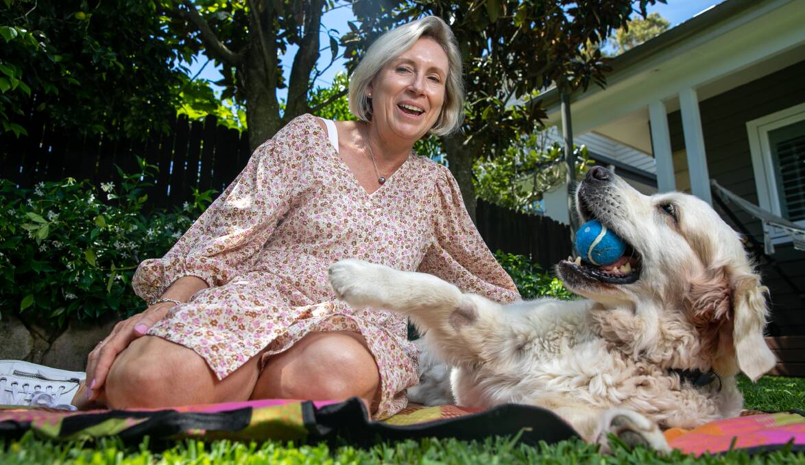 LUCKY: Sally Nicholson and her golden retriever Alva who was taken to the emergency vet with tick paralysis. Picture: Geoff Jones