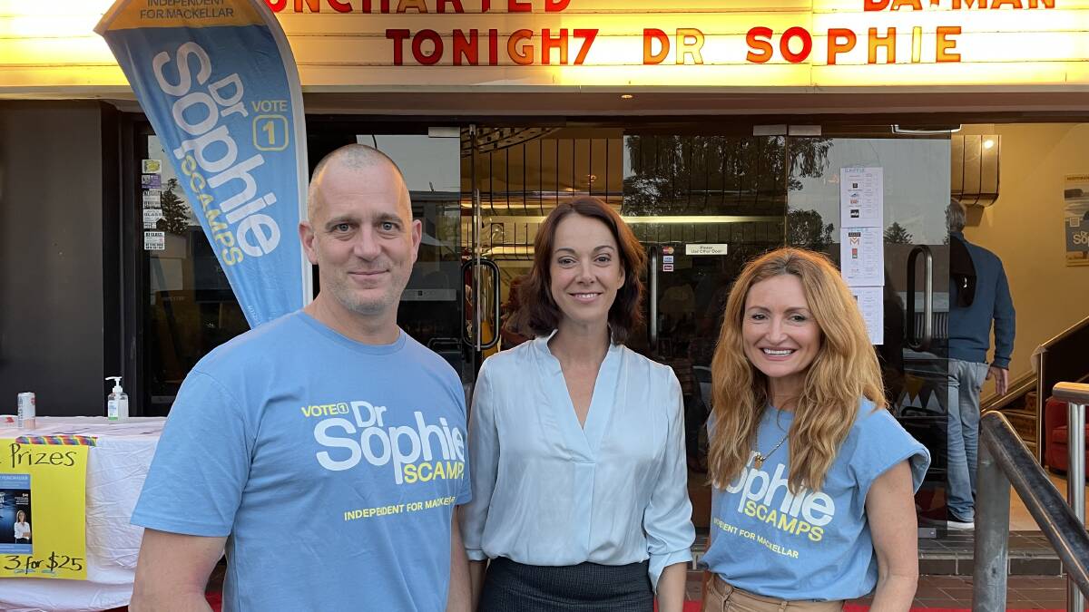 Avalon resident 'Fast' Ed Halmagyi emceed a rally for Dr Sophie Scamps at Avalon cinema. They are pictured with Genevieve Smart who owns fashion label Ginger & Smart. Picture: Supplied