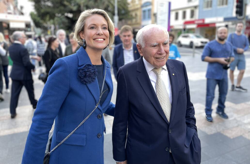 Liberal candidate for Warringah Katherine Deves and former Prime Minister John Howard in Manly Corso ahead of the election. Picture: Nadine Morton