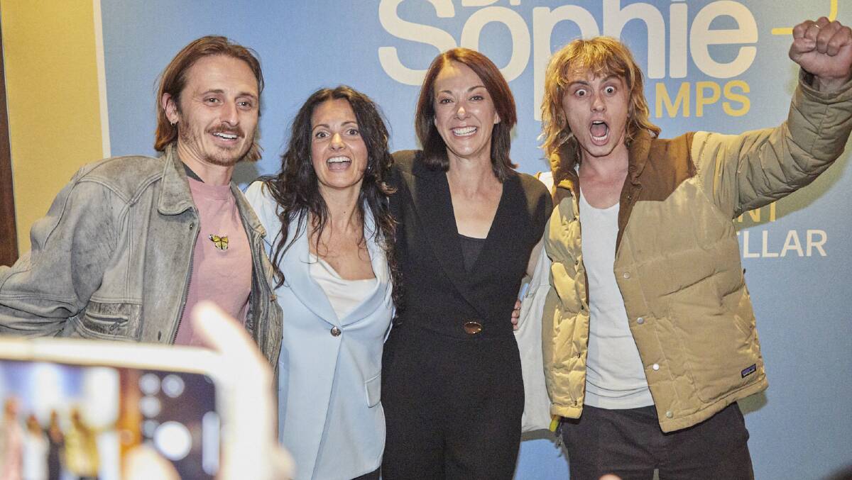 Dr Sophie Scamps celebrating with her campaign director Anyo Geddes (second from left) and Lime Cordiale's Oli and Louis Leimbach. Picture: Chris Barlow