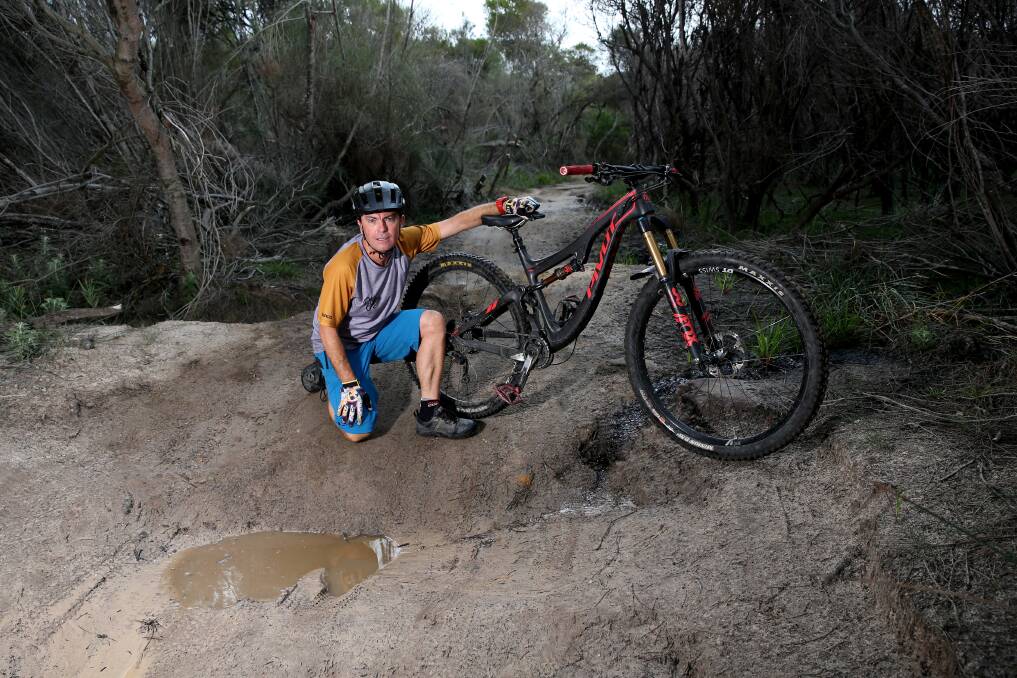 ROUGH RIDE: Stephen Hancock has accused council of neglecting the Manly Dam mountain bike track which he says has become dangerous and an environmental concern. Picture: Geoff Jones